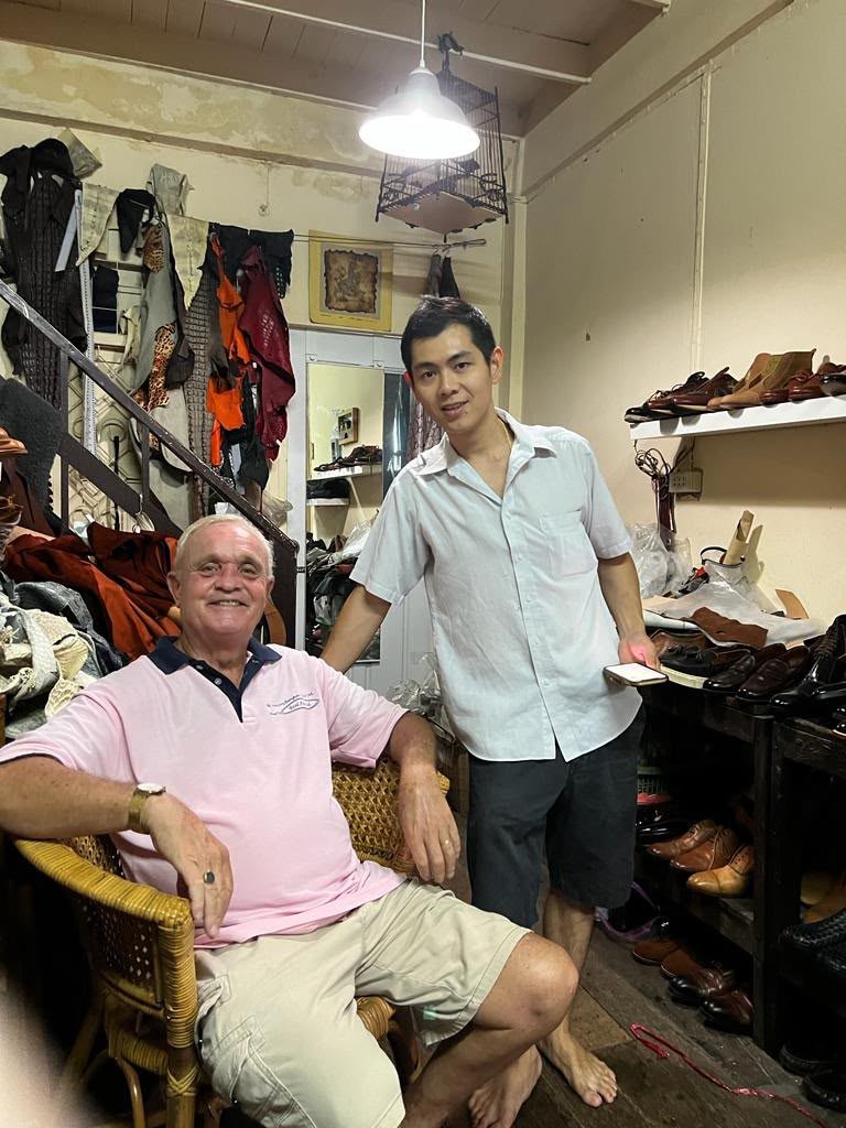 Bell with a longtime client in the atelier