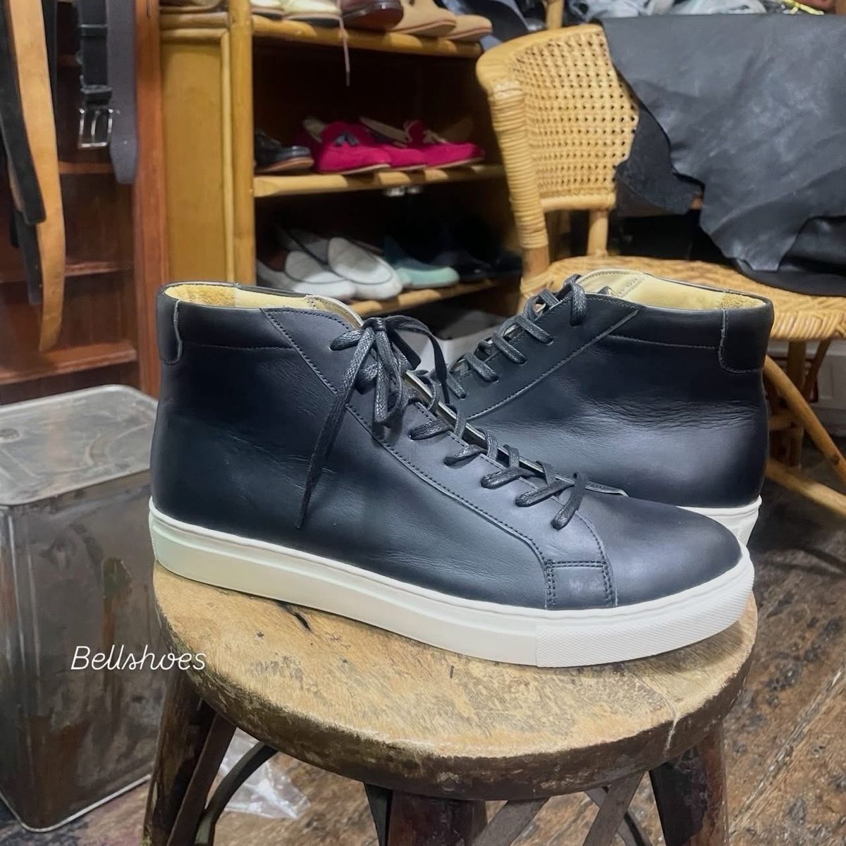 Black leather high-top sneaker, white sole